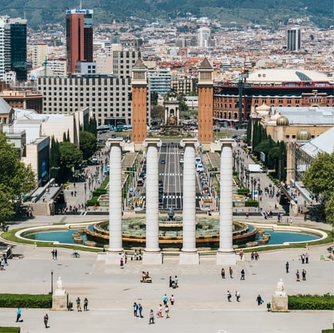 Stroll through bustling Plaça d'Espanya, twenty-five minutes away on foot