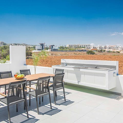Fire up the barbecue at the outdoor kitchen for an evening feast