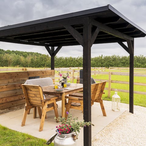 Dine alfresco on a balmy evening under the covered patio