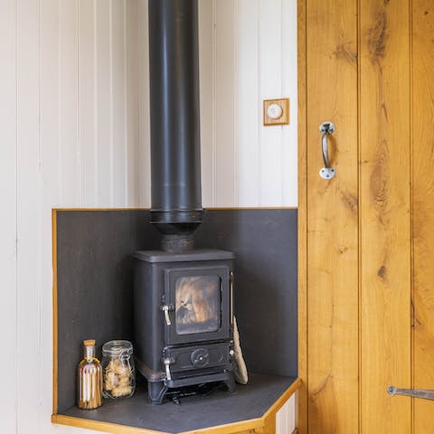 Get cosy around the wood-burning stove with a tumbler of whisky in hand