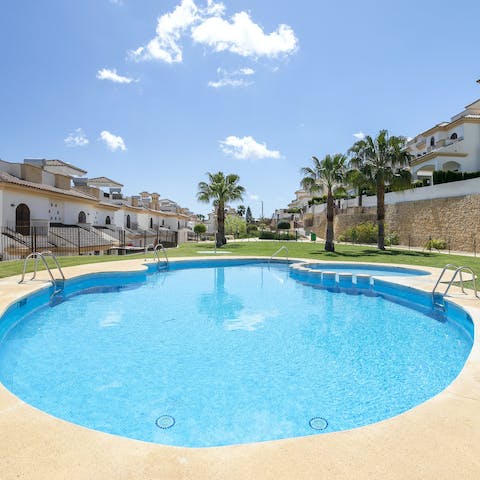 Lounge by the communal pool on balmy afternoons