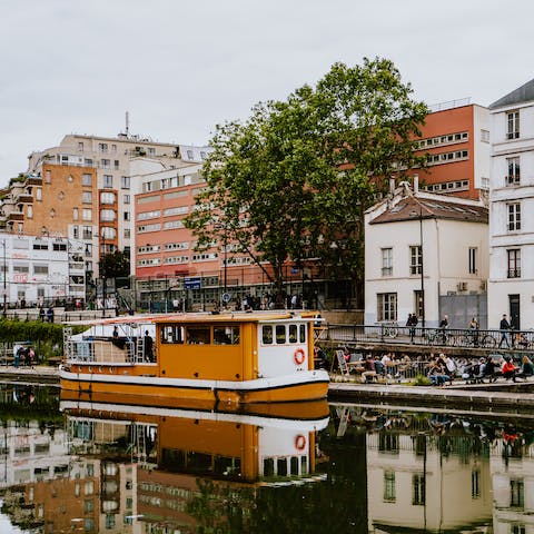 Stay a few steps away from the Canal Saint-Martin and visit the waterside restaurants and bars