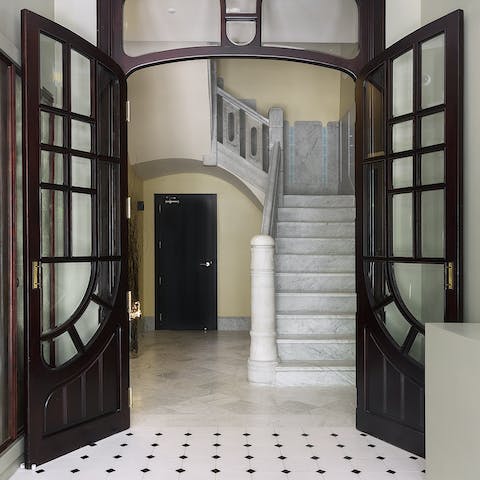 Arrive in style at the grand, marble staircase of your apartment block