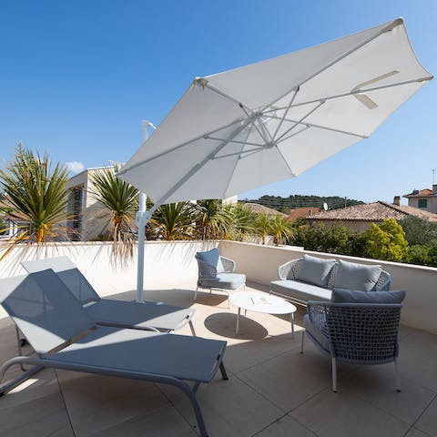 Relax on the sun-drenched terrace on the loungers