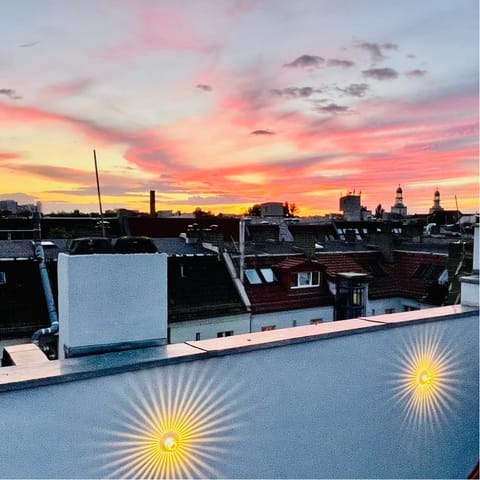 Catch a breathtaking sunset over the rooftops