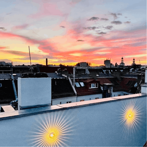 Catch a breathtaking sunset over the rooftops
