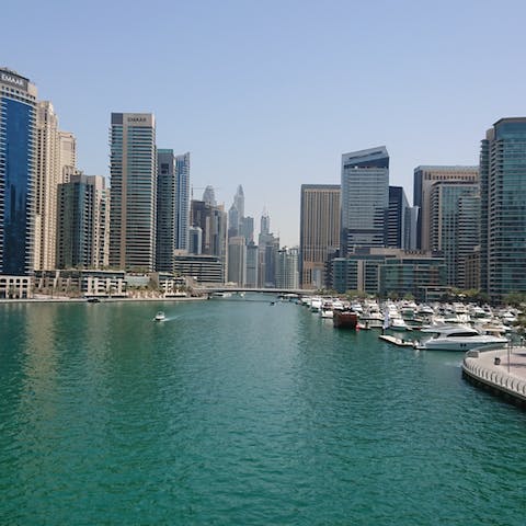 Feel the warm coastal breeze on your skin as you wander around stunning Dubai Marina