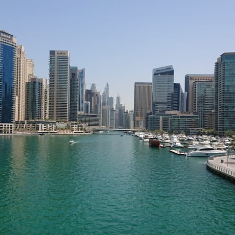 Feel the warm coastal breeze on your skin as you wander around stunning Dubai Marina
