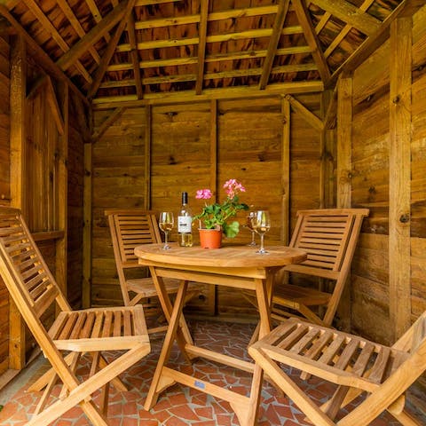 Enjoy an evening tipple in the charming cabin
