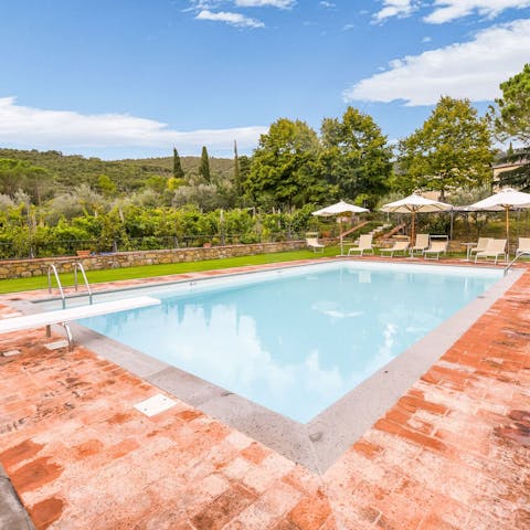 Splash about in the villa's large swimming pool surrounded by Tuscan countryside