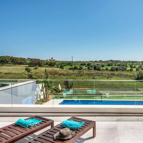 Soak up landscape views over the surrounding countryside from the balcony loungers