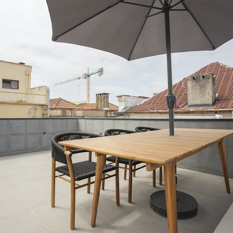 Feast on traditional petiscos and local wine on the private roof terrace