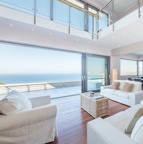Slide open the glass doors to blend the breezy living room with the terrace
