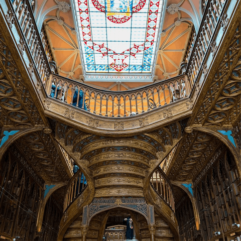Marvel at the books on display at Livraria Lello