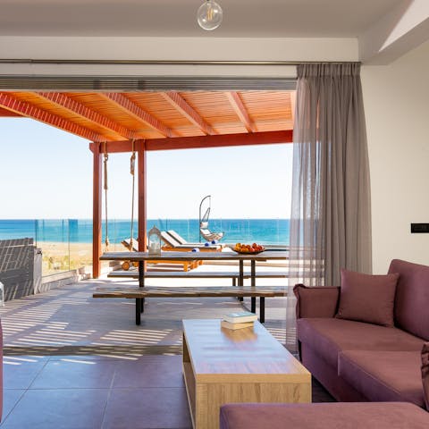 Draw the curtains and pull back the large glass door to enjoy sea breezes right from the couch