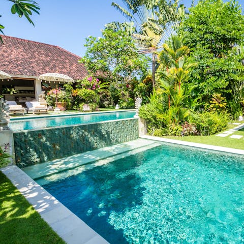 Slip into one of three swimming pools in the private garden