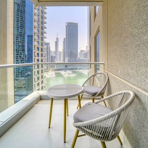 Take in captivating views over the waterfront and city skyline from the balcony