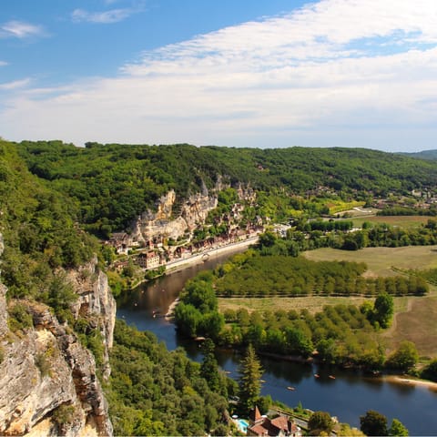 Explore the bucolic landscape and historic castles in the surrounding Dordogne region