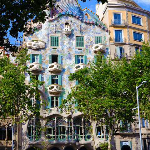 Visit  Gaudí's colourful  Casa Batlló, a three-minute walk away