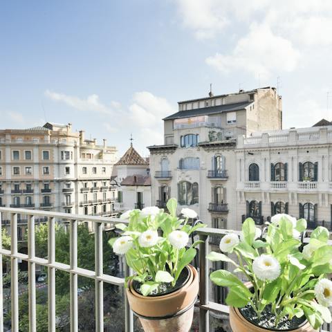 Perch by one of the Juliet balconies with a glass of  Spanish wine while indulging in some people-watching