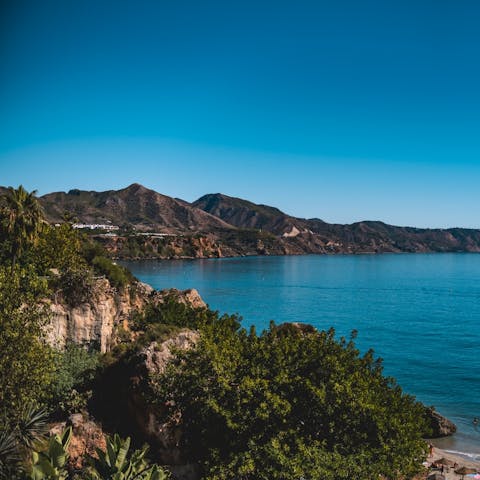 Explore the beautiful landscapes and pristine beaches of Nerja