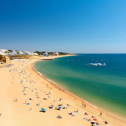 Enjoy a day on the sands of Olhos de Água, just 12km away