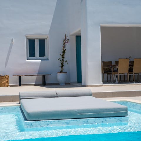 Rest on a sun bed after a dip in the private pool