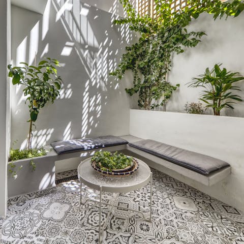Enjoy the shade on your private courtyard with gorgeous Mediterranean styling