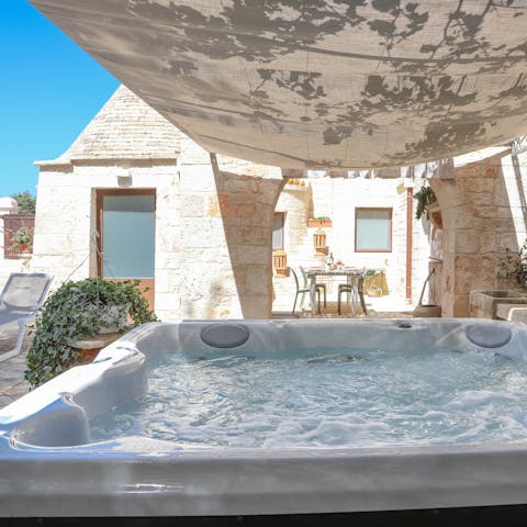 Indulge in a soak in the covered Jacuzzi 