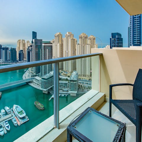 Sit out on the balcony and watch the boats float by on the Marina