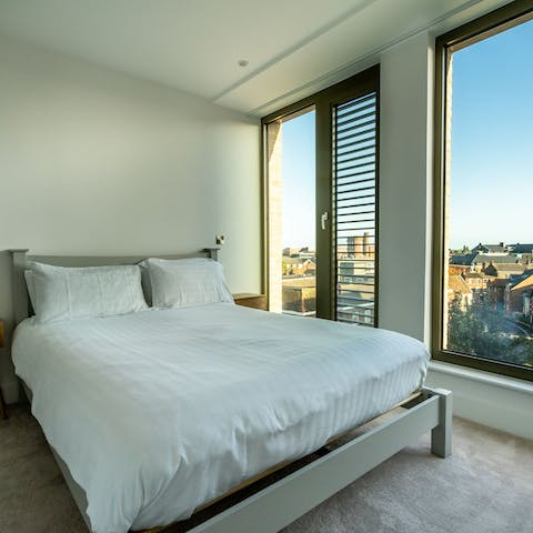 Wake up to rooftop views over the city from the comfortable bedrooms