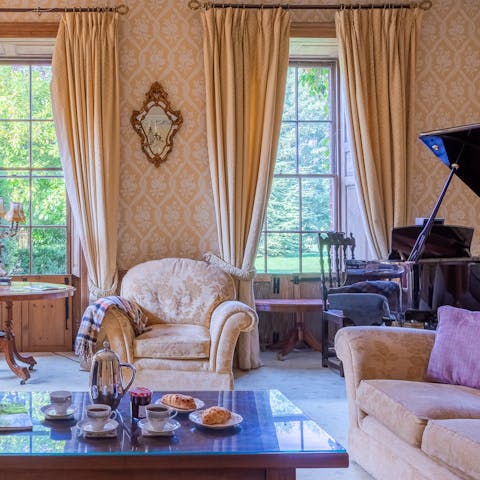 Sip afternoon tea in the regal living room with a grand piano
