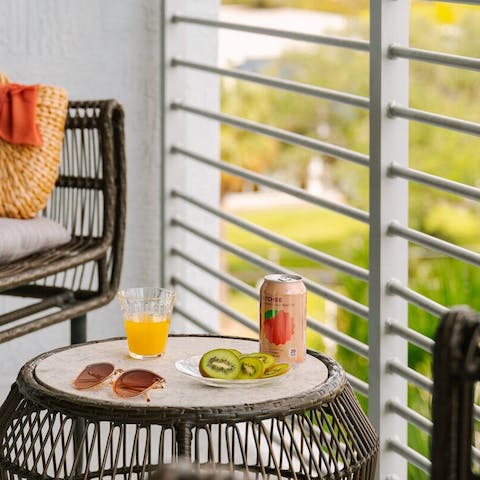 Sip your morning coffee on the private balcony, taking in the city views