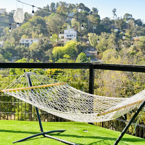 Catch forty winks in the hammock overlooking the hills
