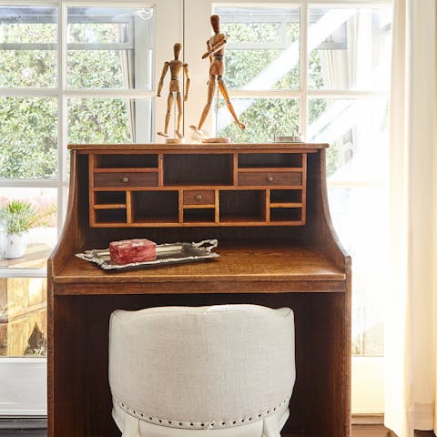 Get some work done at the sunny antique desk