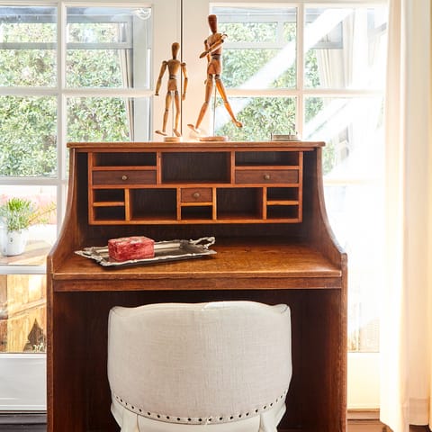 Get some work done at the sunny antique desk