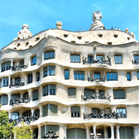 Visit the striking rooftop of Casa Milà, just under a twenty-minute walk from home