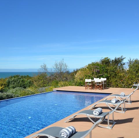 Swim out to the edge of the infinity pool to admire the beautiful view