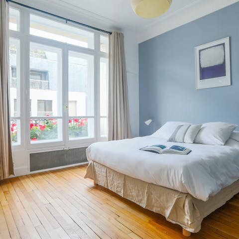 Wake up to charming views of Parisian life below