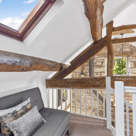 Open a bottle of wine and relax with a book under the wooden beams