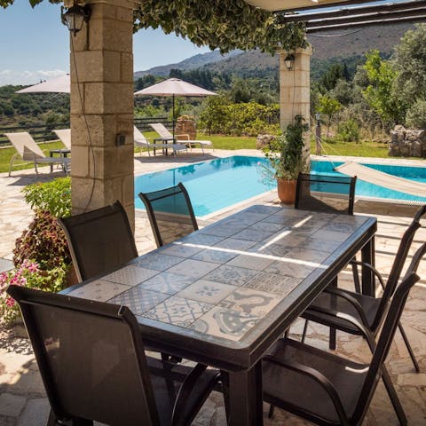 Dine alfresco beside the pool