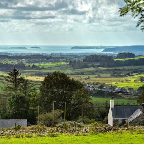 Take in far reaching views over the mountains and out to sea