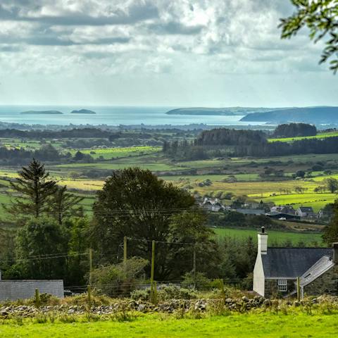 Take in far reaching views over the mountains and out to sea