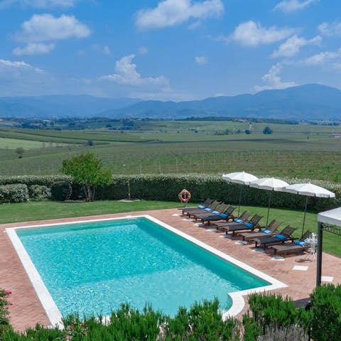Admire views of the Tuscan countryside from the swimming pool