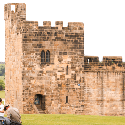Check out historic Alnwick Castle – it's only six miles away