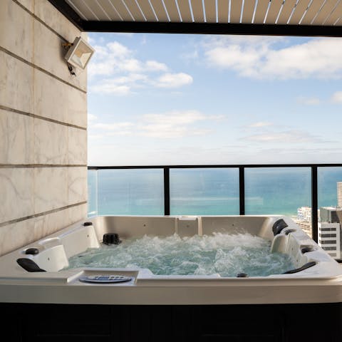 Admire the view as you sit back in the luxurious hot tub