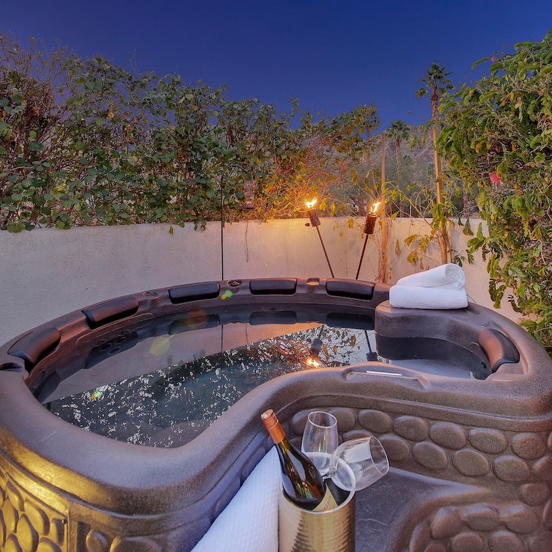 Soak in the hot tub with a glass of something bubbly