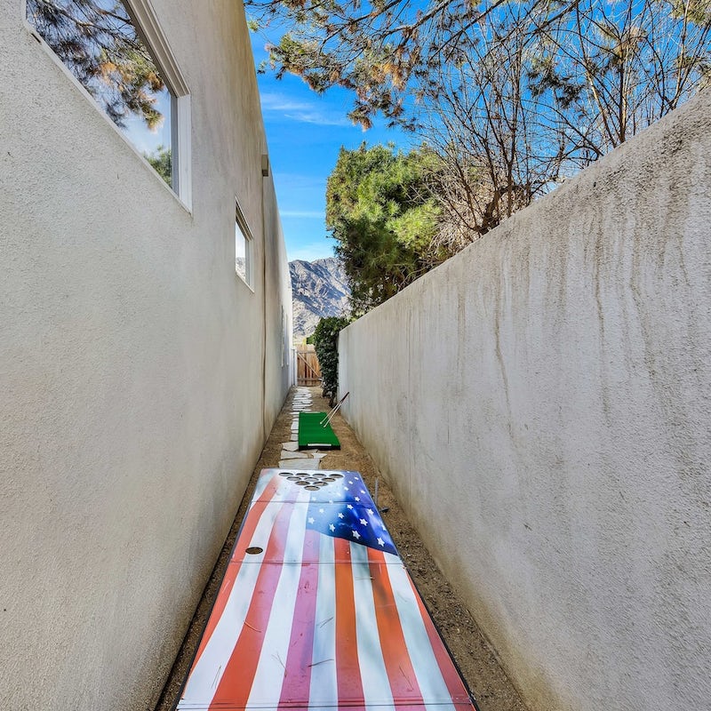 Find the secret mini golf and shuffleboard behind the house