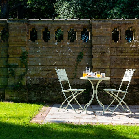 Enjoy morning coffee and sumptuous alfresco meals in the picturesque walled garden