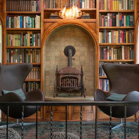 Select a book off the shelf and get cosy in the library by the cast iron fireplace